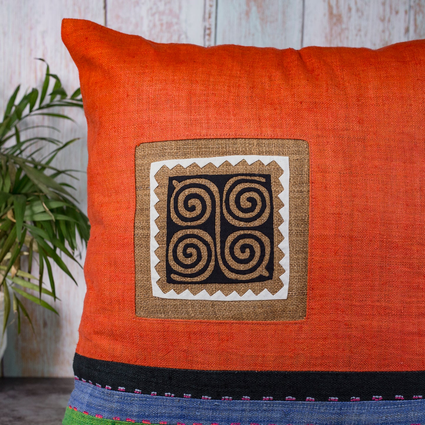 Orange Hemp Cushion Cover with stripes in different colors, hand-stitched pattern in black and brown