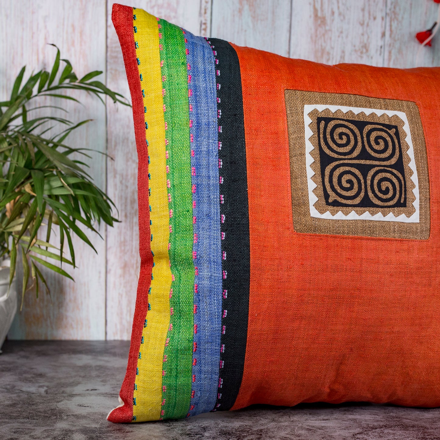 Orange Hemp Cushion Cover with stripes in different colors, hand-stitched pattern in black and brown