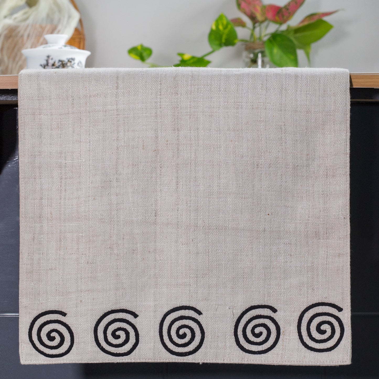 White Hemp Table Runner, patterns on black background, hand-stitched details at both ends