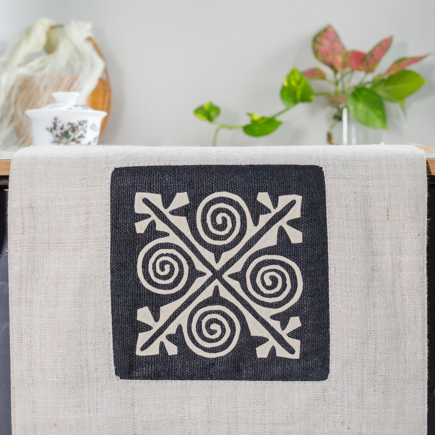 White Hemp Table Runner, patterns on black background, hand-stitched details at both ends