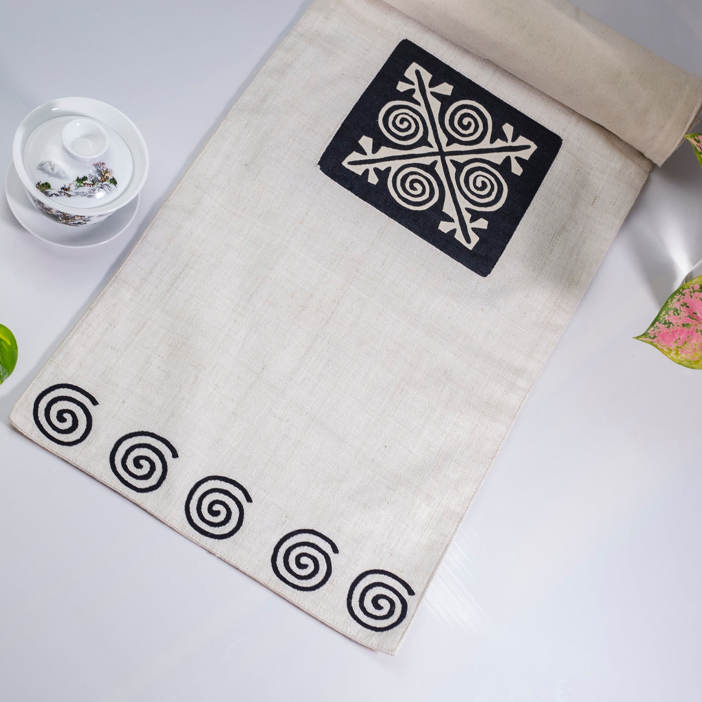 White Hemp Table Runner, patterns on black background, hand-stitched details at both ends