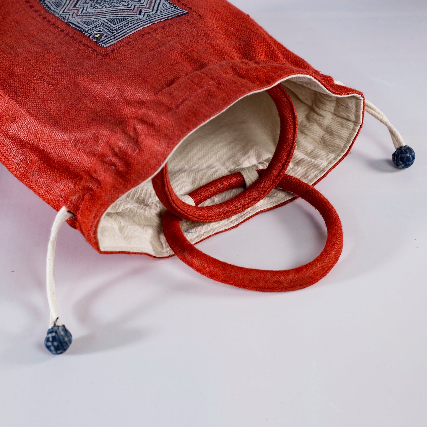 Red drawstring hemp handbag, natural hemp and batik patch