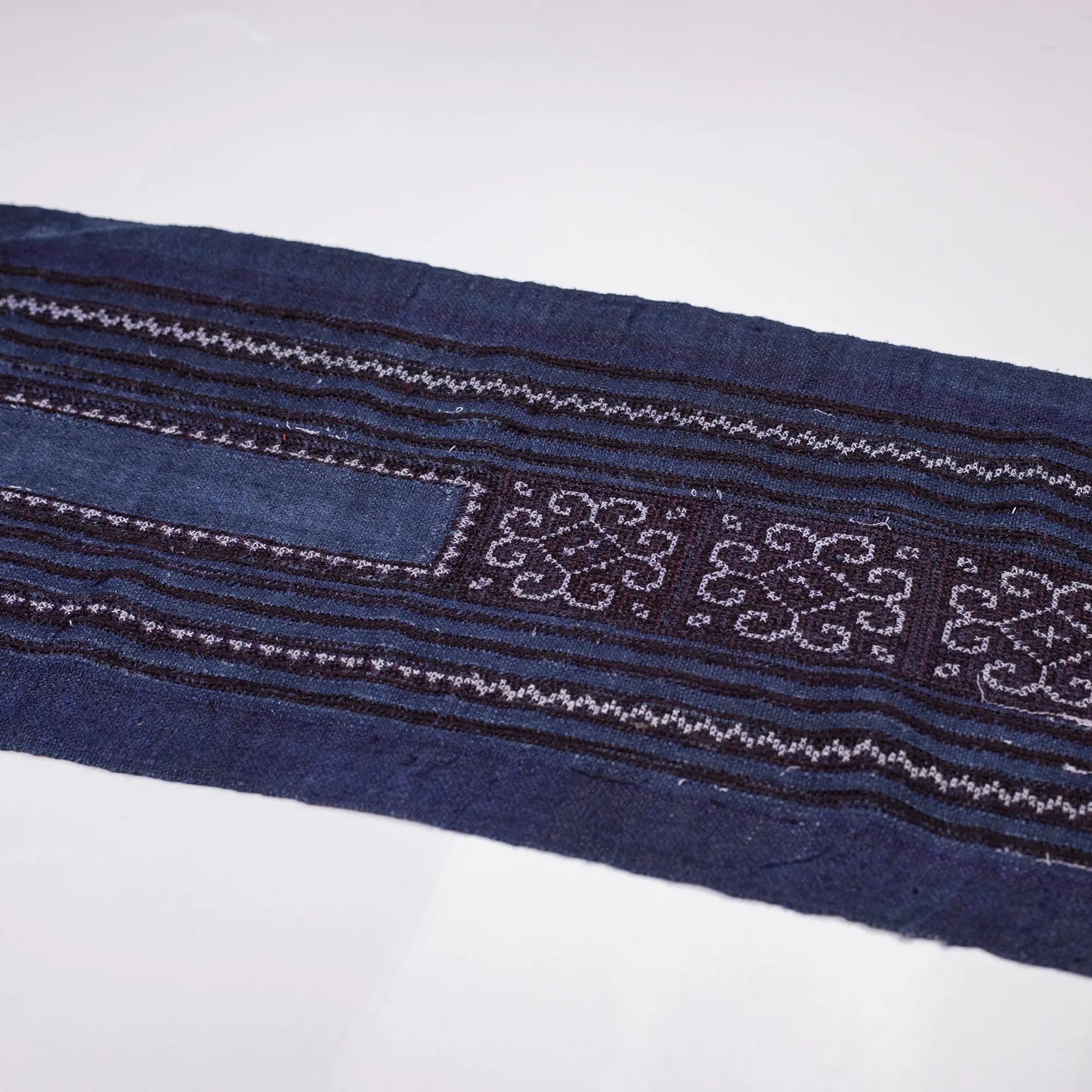 Vintage cross-stitch embroidery roll in flowery pattern