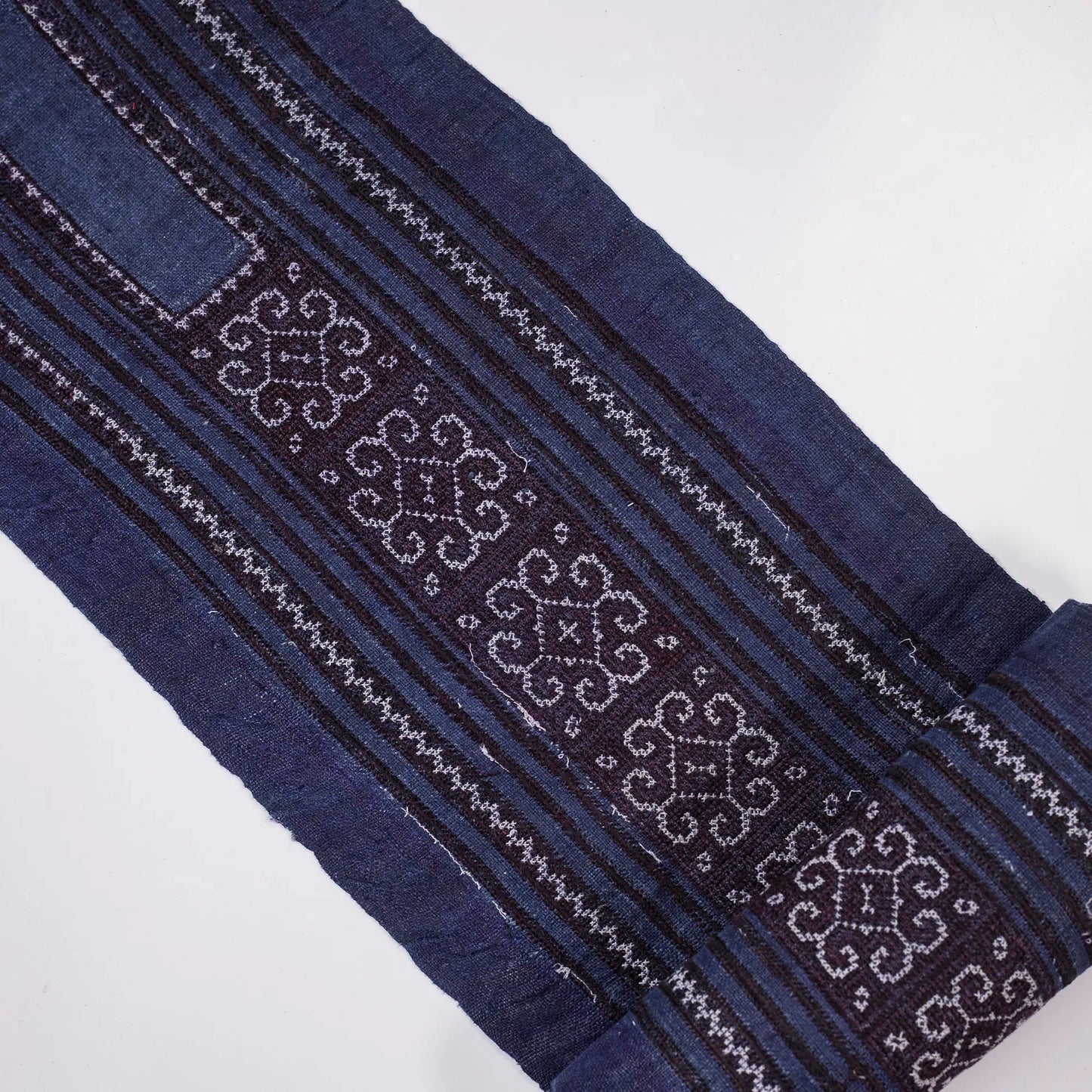 Vintage cross-stitch embroidery roll in flowery pattern