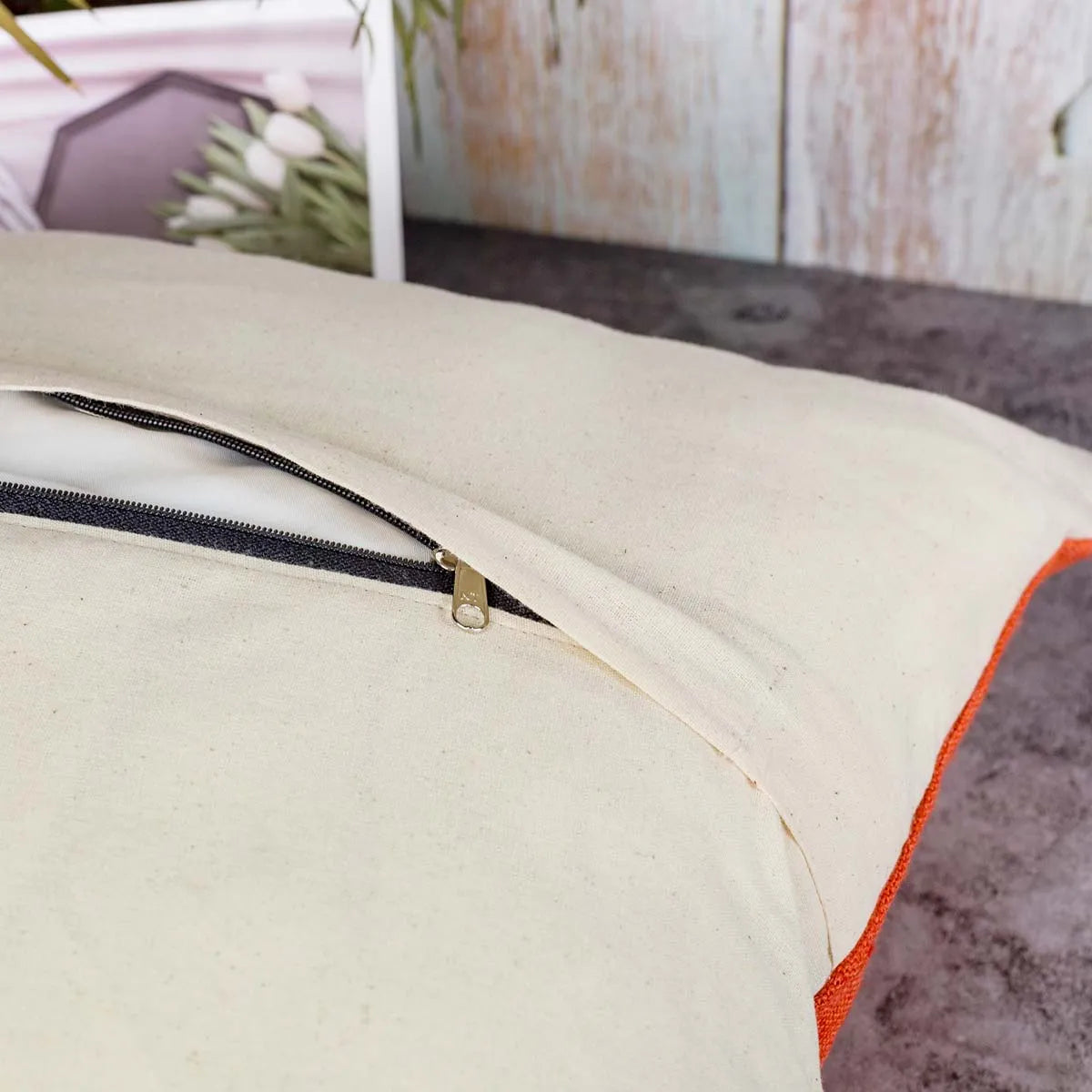 Vindigo cushion cover orange striped spiral zipper detail view