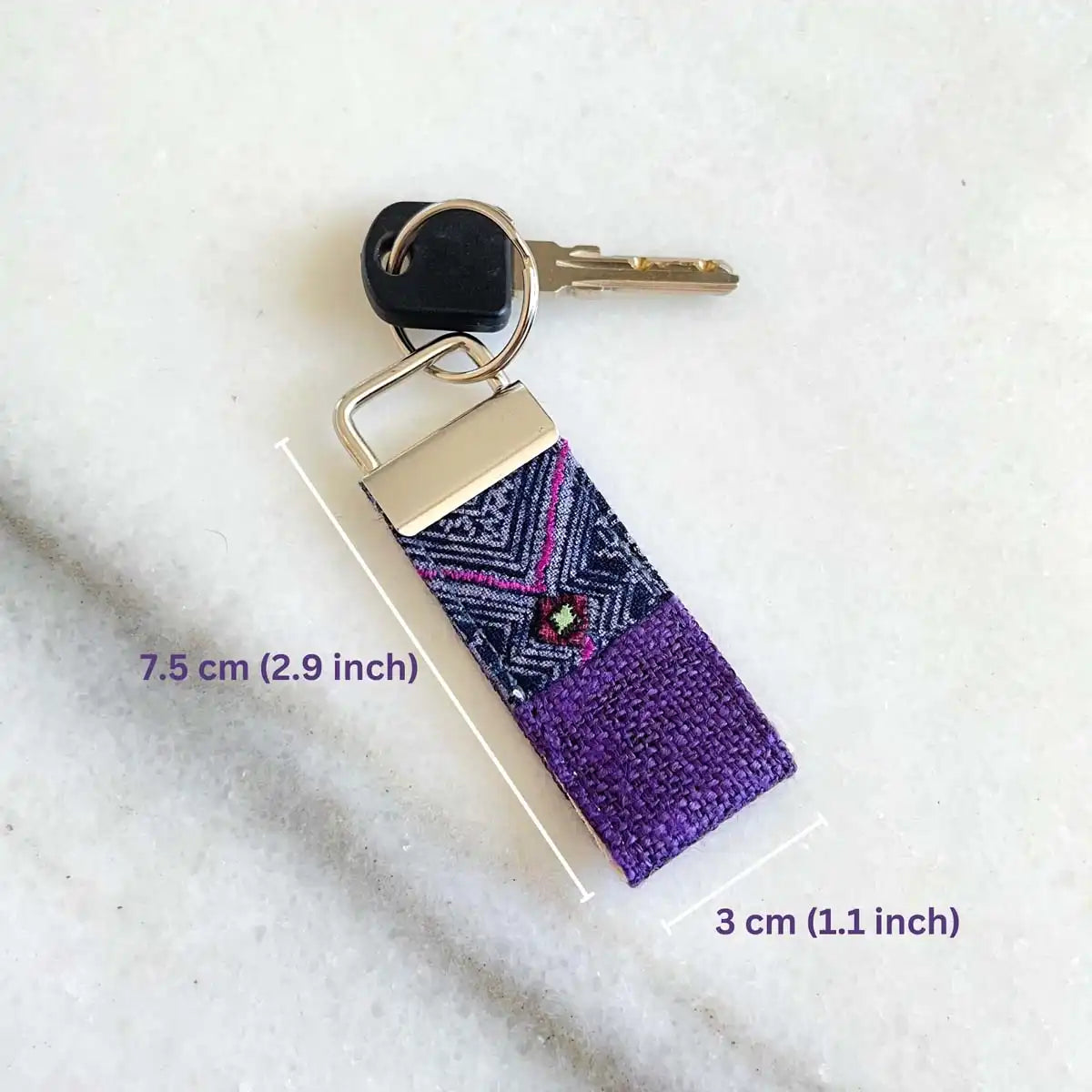 Vindigo keychain brown embroidered lifestyle view with key