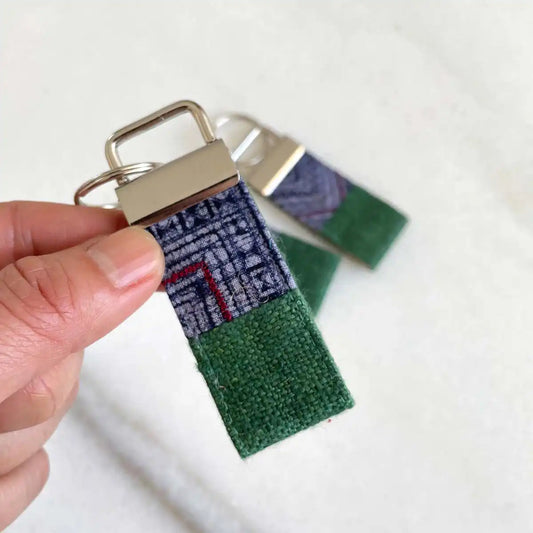 Vindigo keychain dark green embroidered close detail in hand