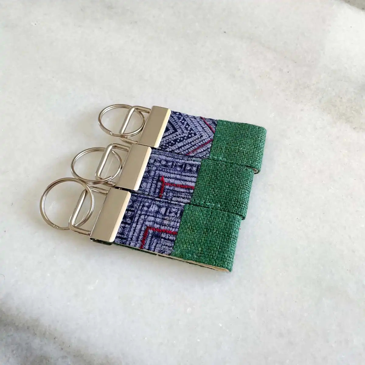 Vindigo keychain dark green embroidered front angled close view