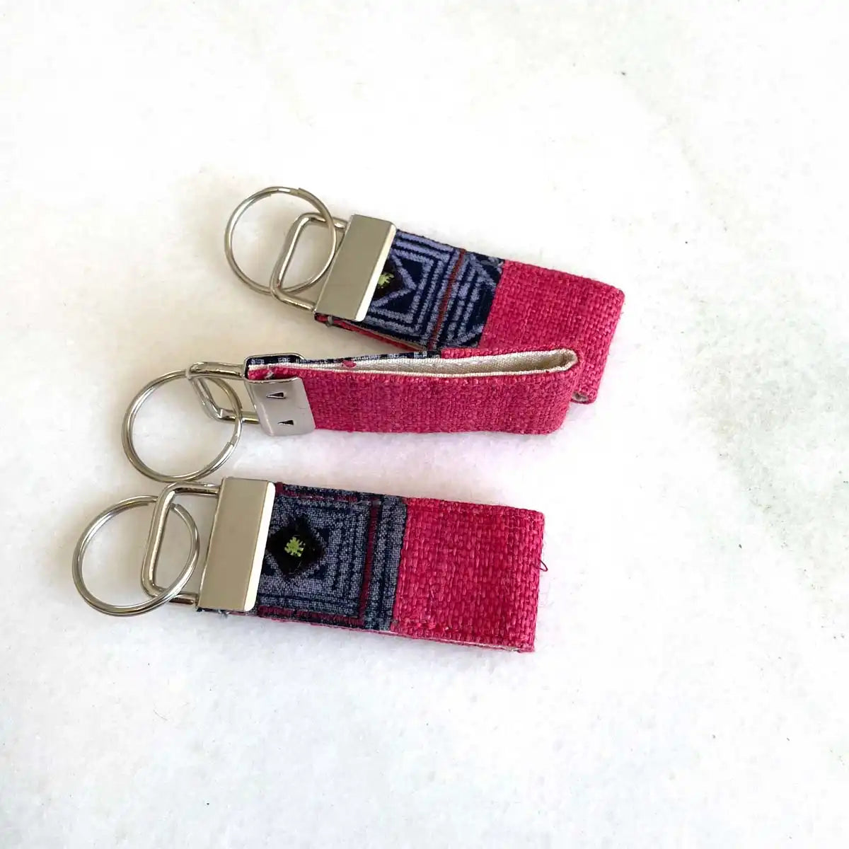 Vindigo keychain pink embroidered flat lay group front view