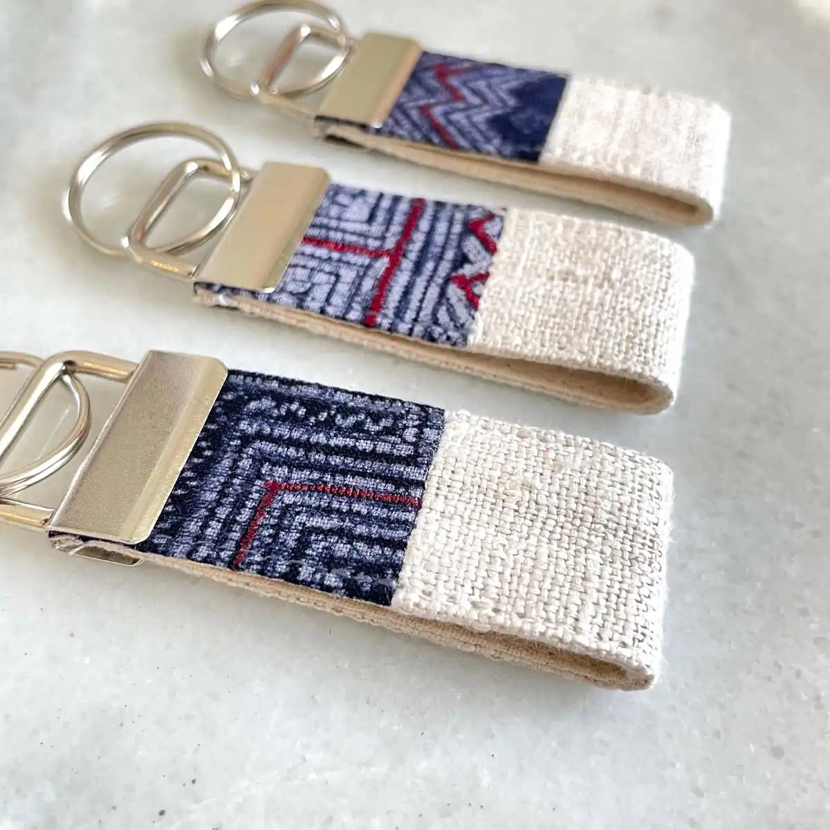 Vindigo keychain white embroidered group close front view