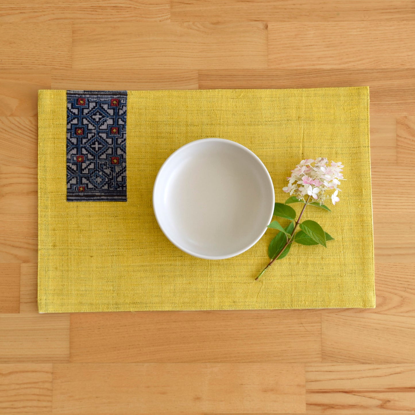 Yellow hemp placemat, vintage batik indigo patch, hand-woven hemp fabrics