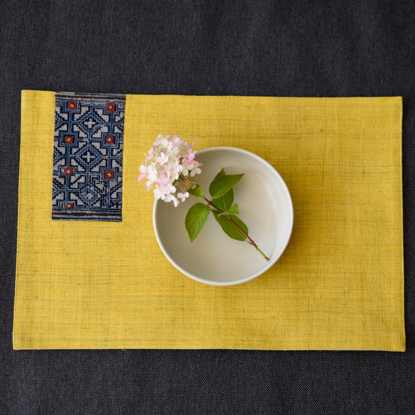 Yellow hemp placemat, vintage batik indigo patch, hand-woven hemp fabrics