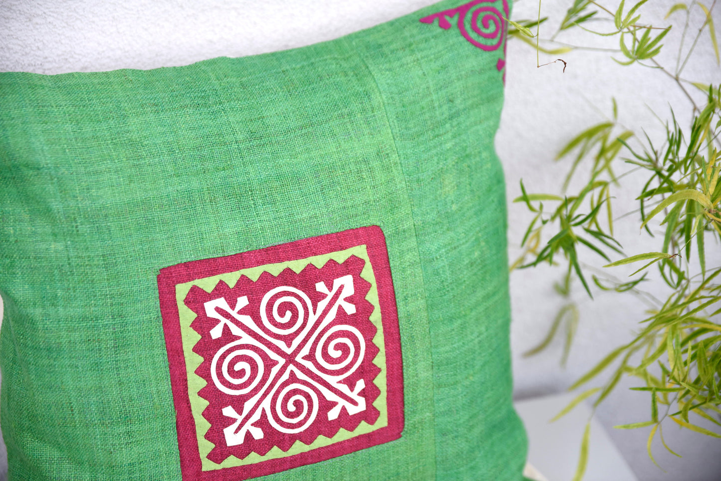 Green Cushion Cover (45x45 cm), embroidered corners, white patch on pink background