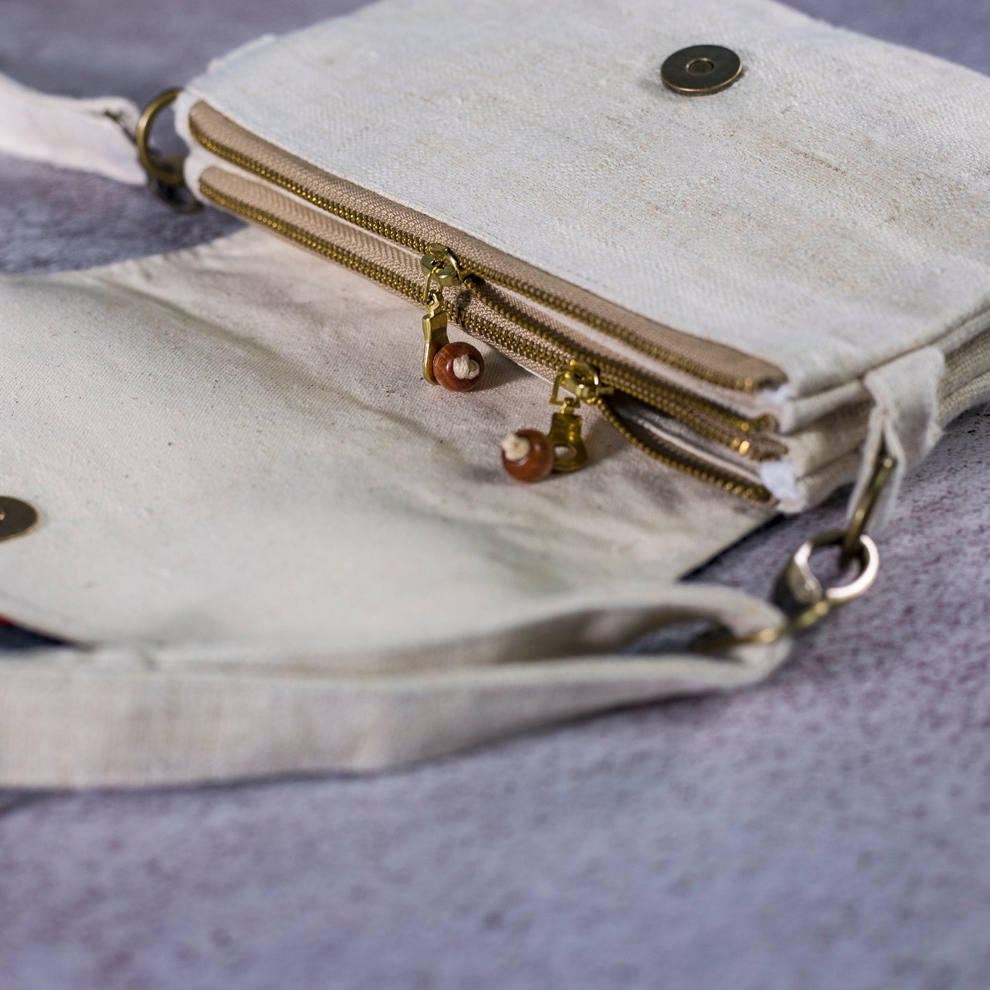 Unique folded cross-body bag in natural hemp and batik flap in dark-blue indigo