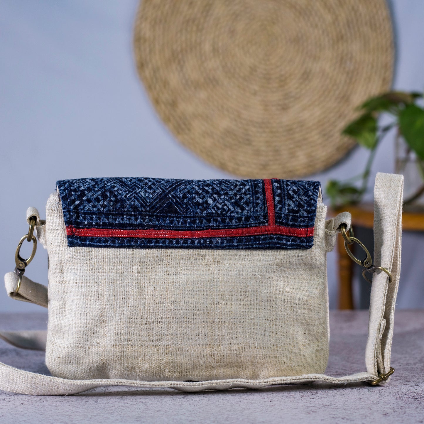 Unique folded cross-body bag in natural hemp and batik flap in dark-blue indigo