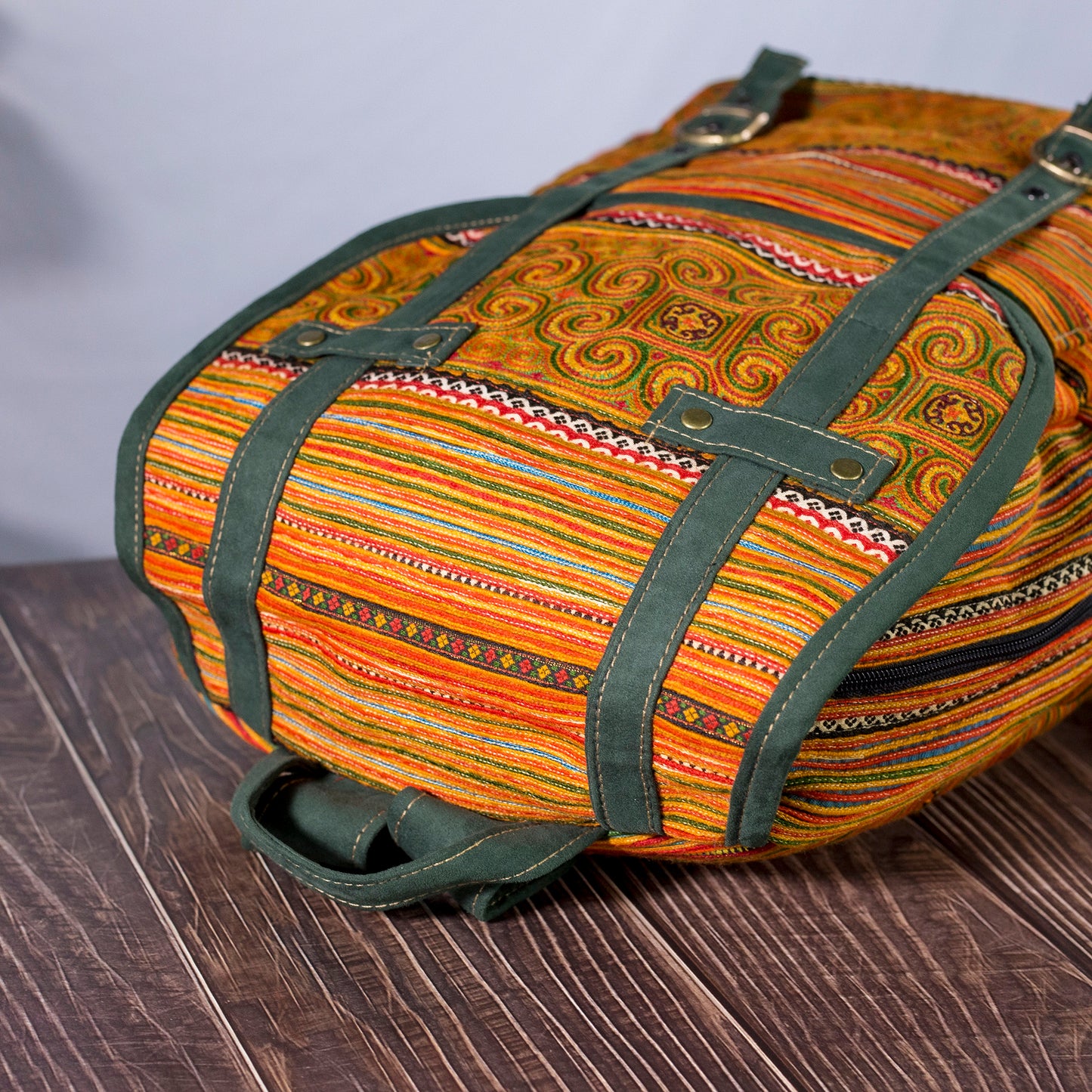 Big-sized backpack, orange hand-embroidery fabric, faux leather trim, moss green color