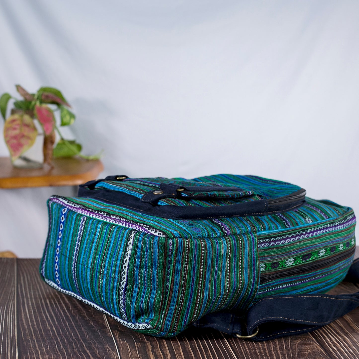 Big-sized backpack, round pocket in front, blue hand-embroidery fabric, black faux leather trim