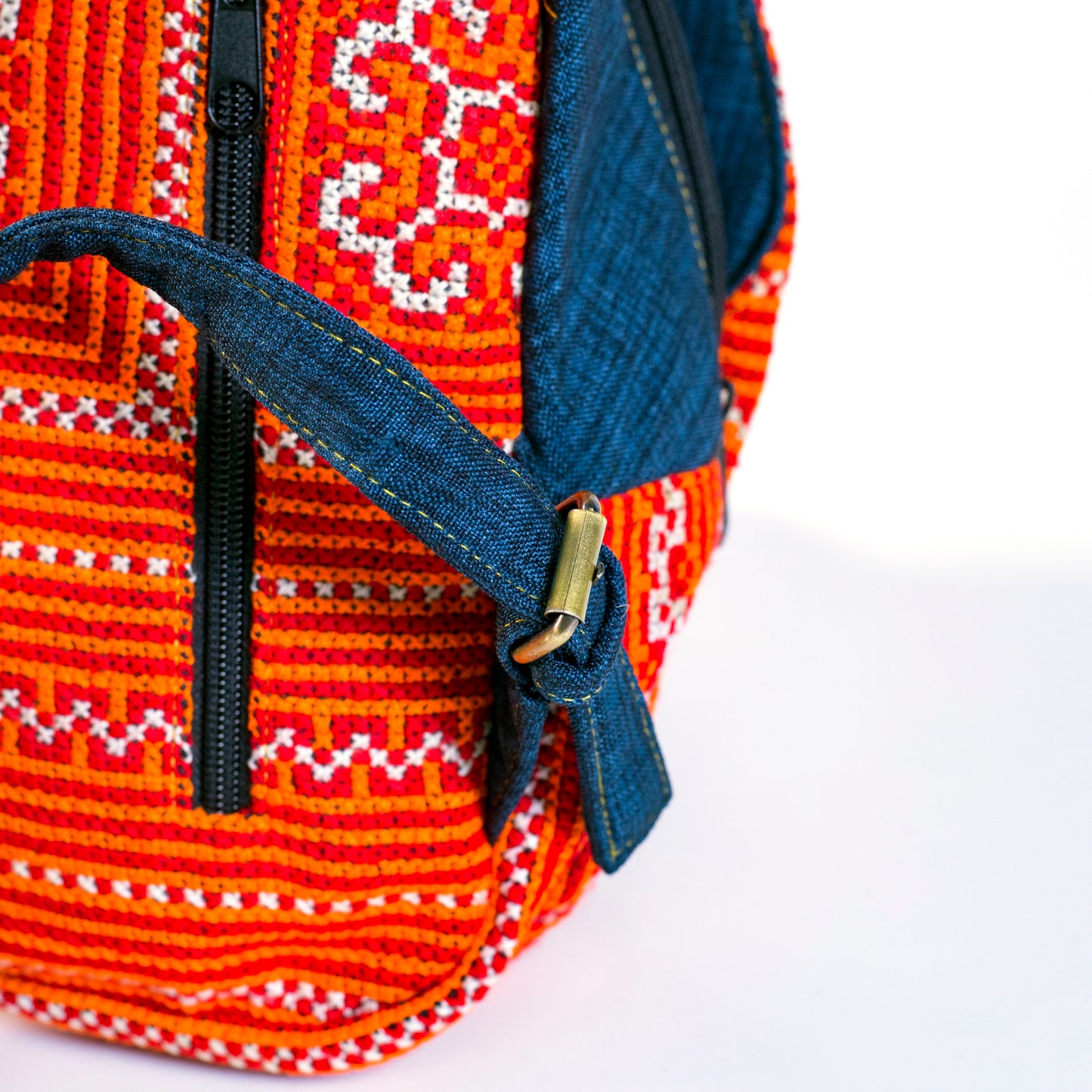 Multi-purpose backpack and sling, red hand-embroidery fabric, blue trim