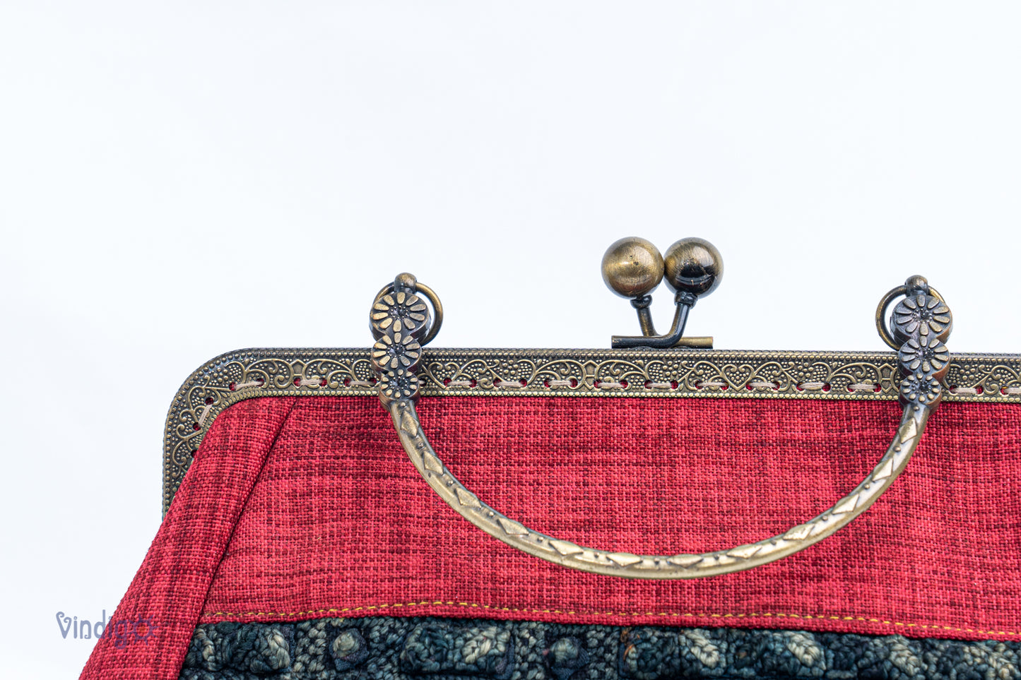 Red bag with vintage tribal embroidery and straight copper-binding