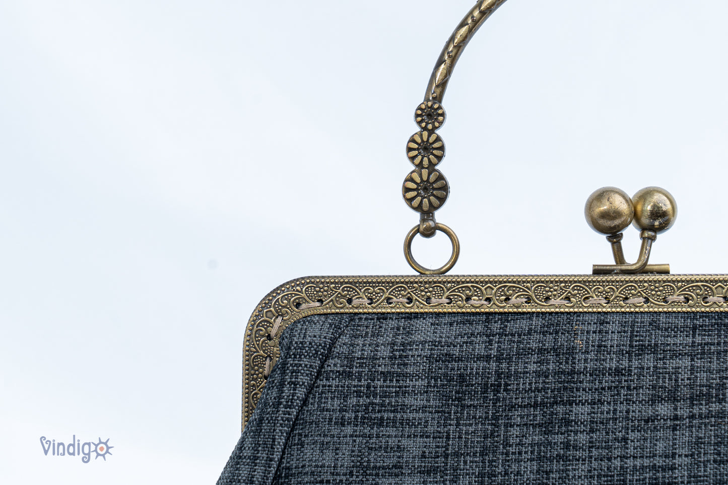 Grey bag with vintage tribal embroidery and straight copper-binding