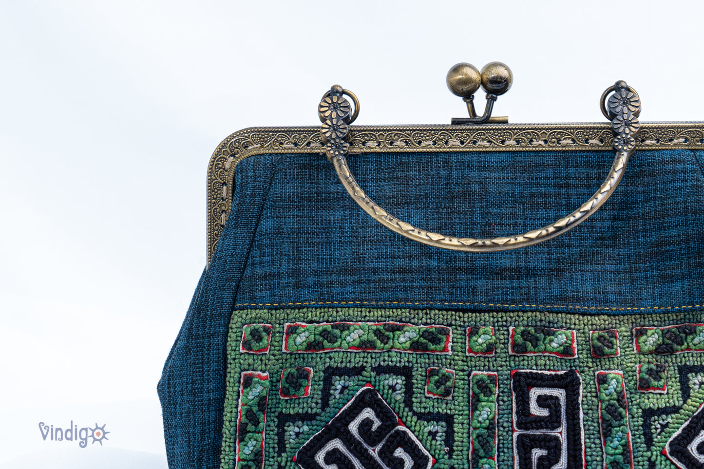 Blue bag with vintage tribal embroidery and straight copper-binding