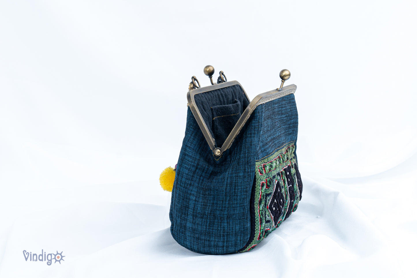 Blue bag with vintage tribal embroidery and straight copper-binding