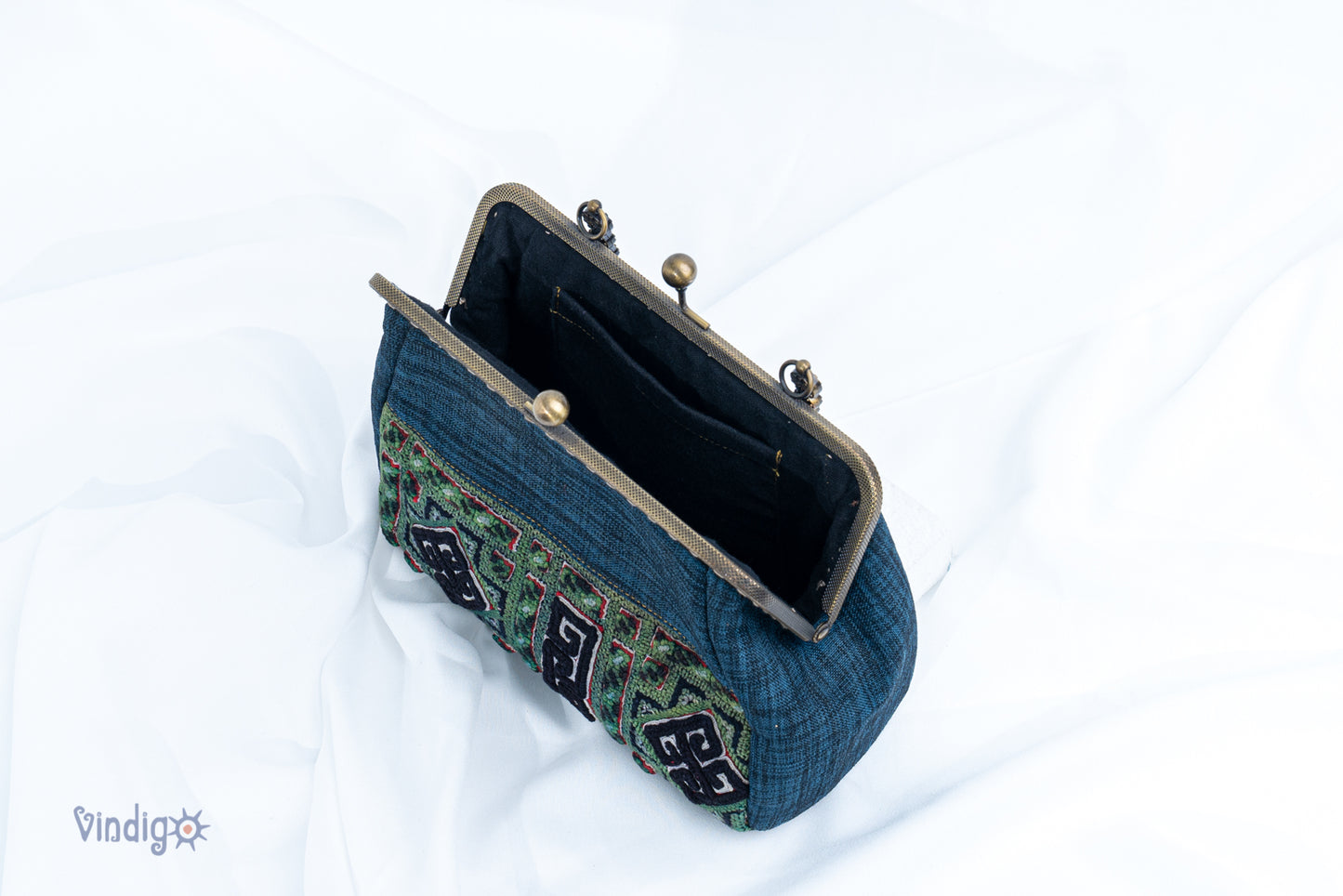 Blue bag with vintage tribal embroidery and straight copper-binding