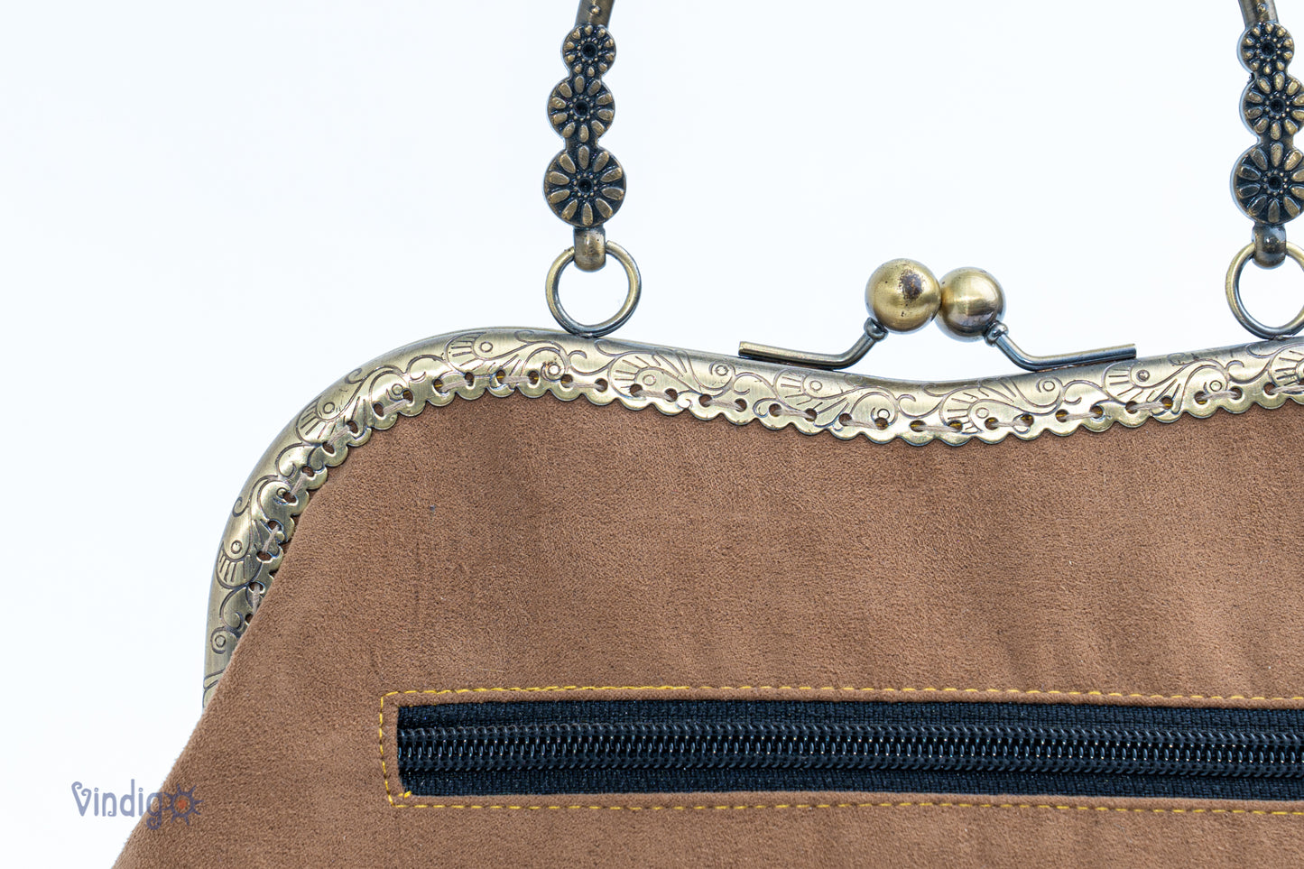 Faux leather bag with vintage tribal embroidery and copper-binding