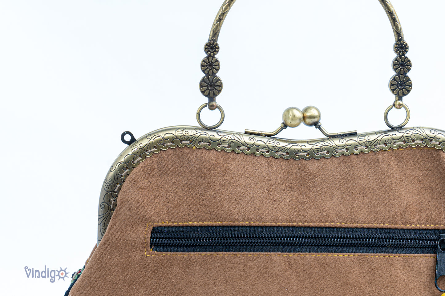 Brown faux leather bag with vintage tribal embroidery and copper-binding