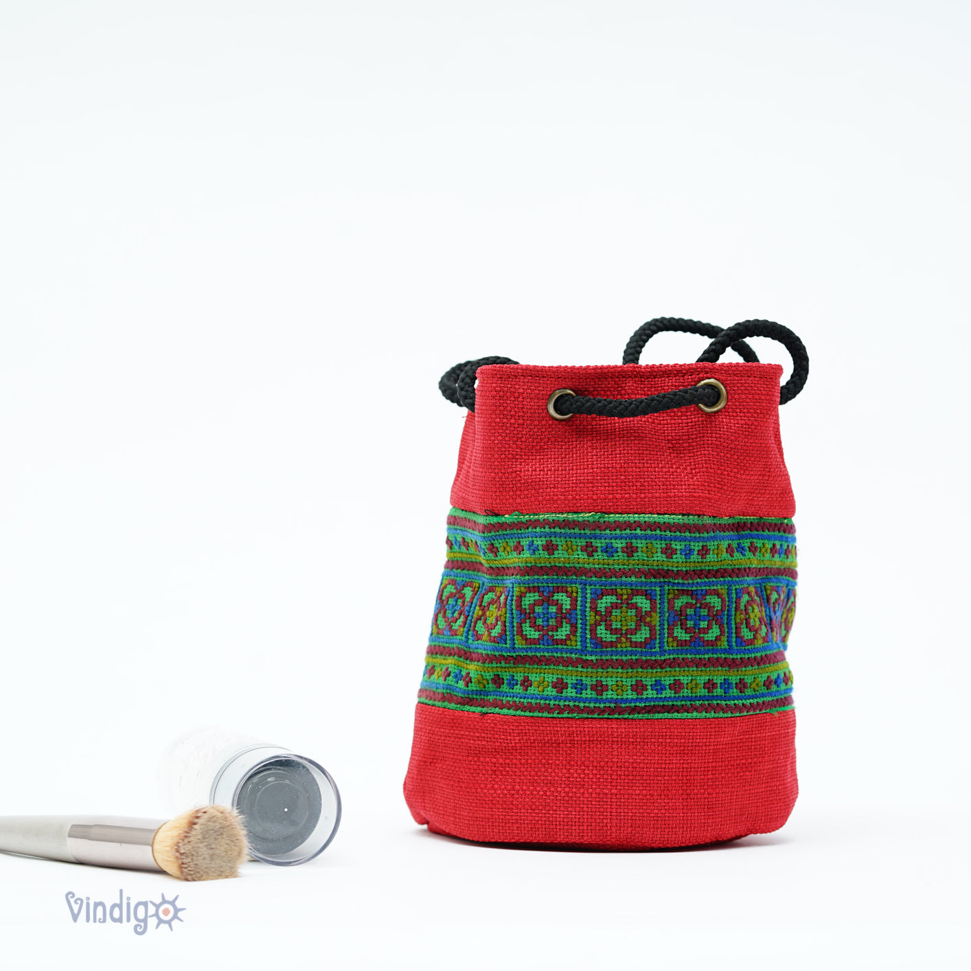 Red multi-purpose bag with string, Hemp, tribal pattern on green background