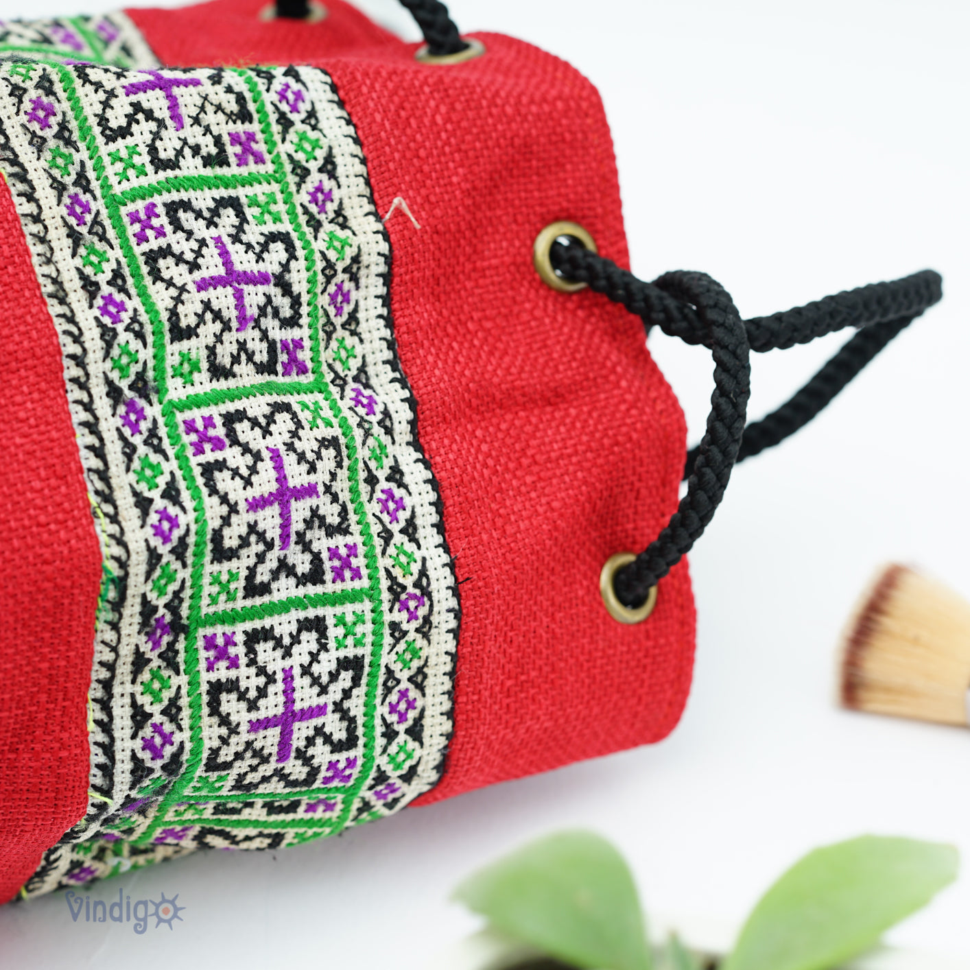 Red mini bag with string, green tribal pattern