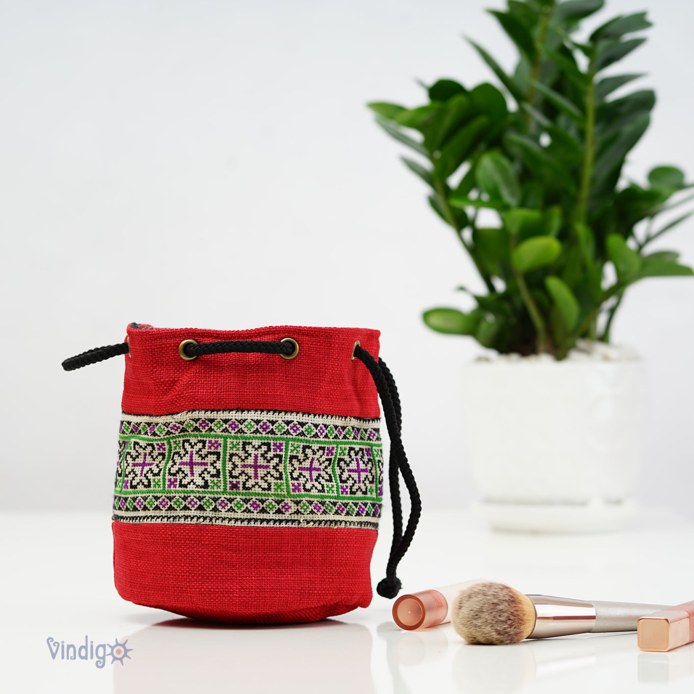 Red mini bag with string, green tribal pattern