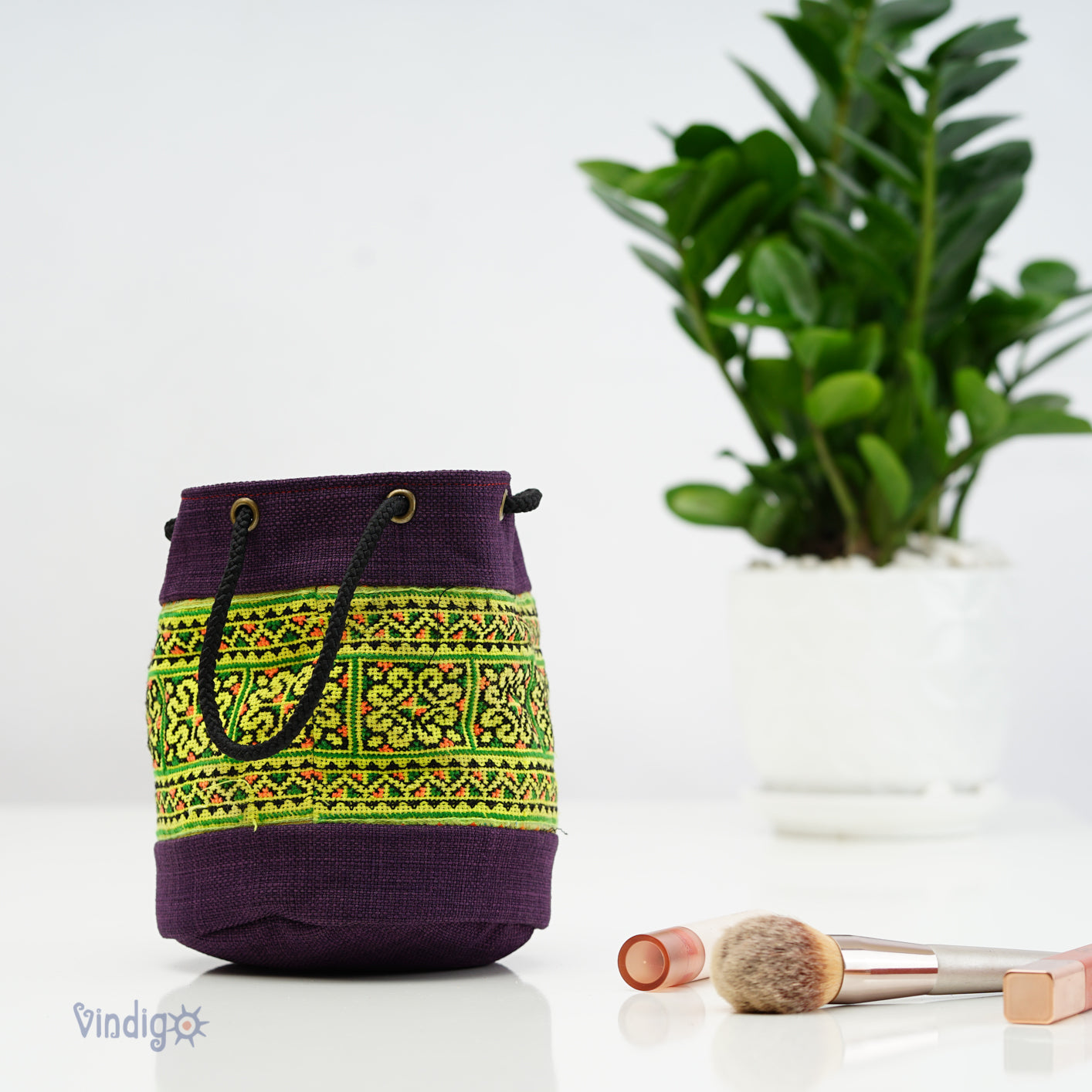 Purple mini hemp bag with string, green tribal pattern