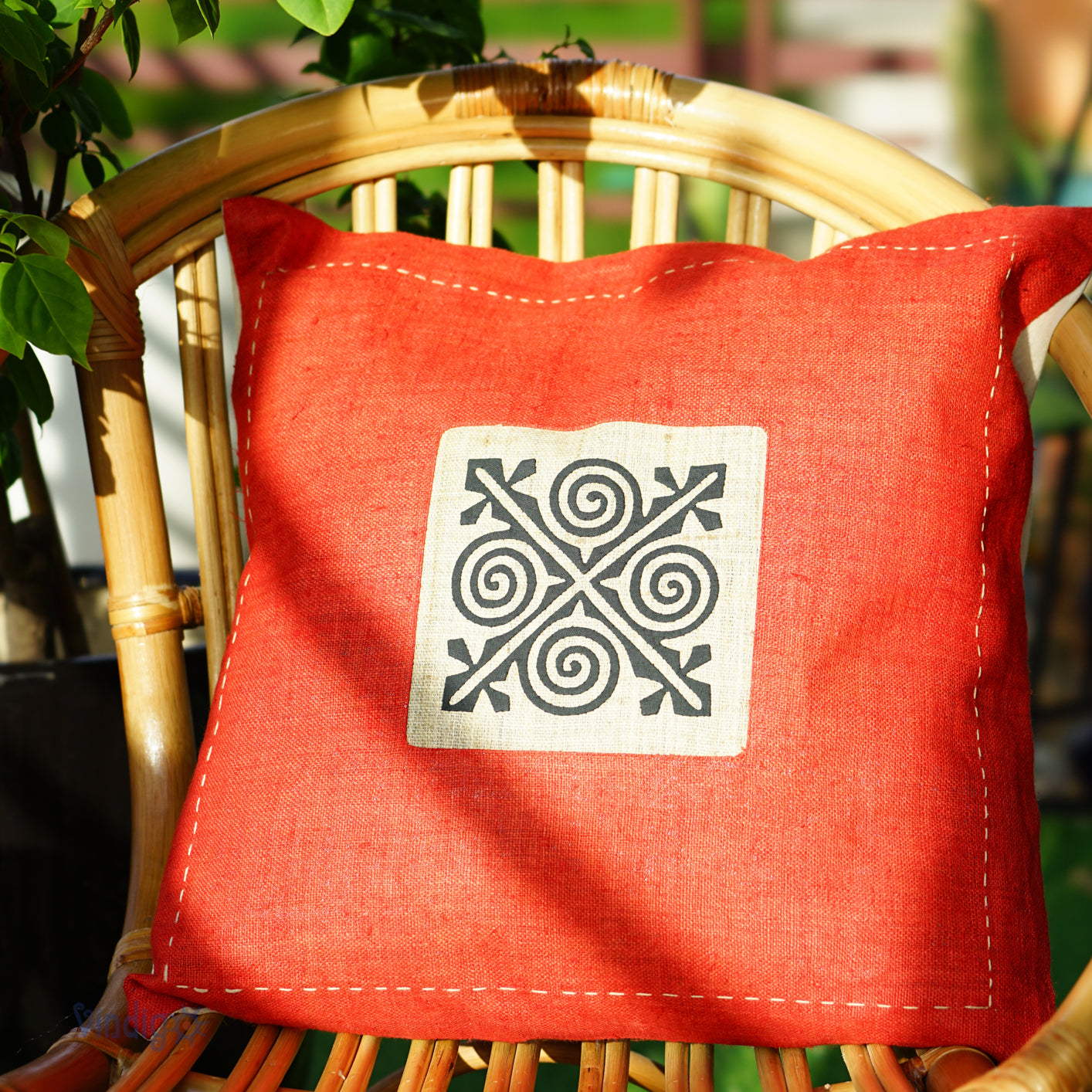 Red Hemp Cushion Cover with hand-stitches run along all sides