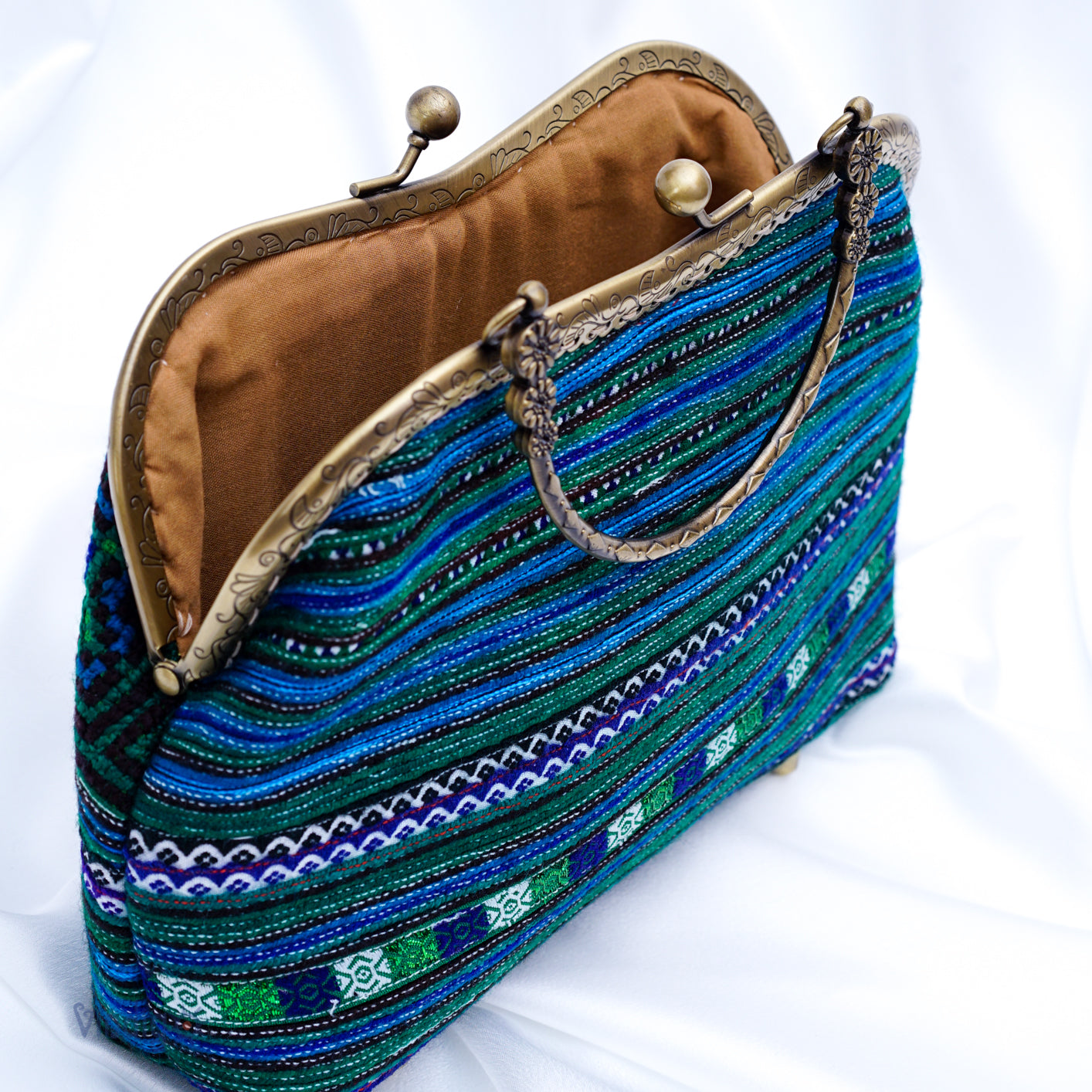 Unique blue embroidered pattern with copper-binding shoulder bag