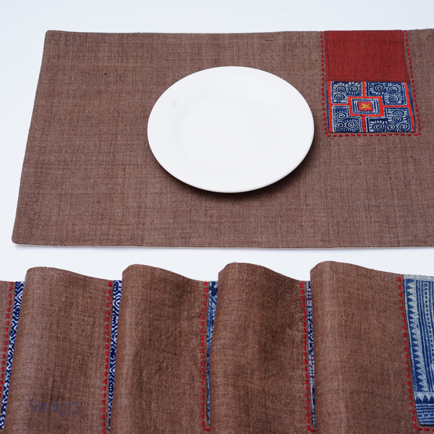 Dark brown hemp placemat, hand-embroidered patch, hand stitches